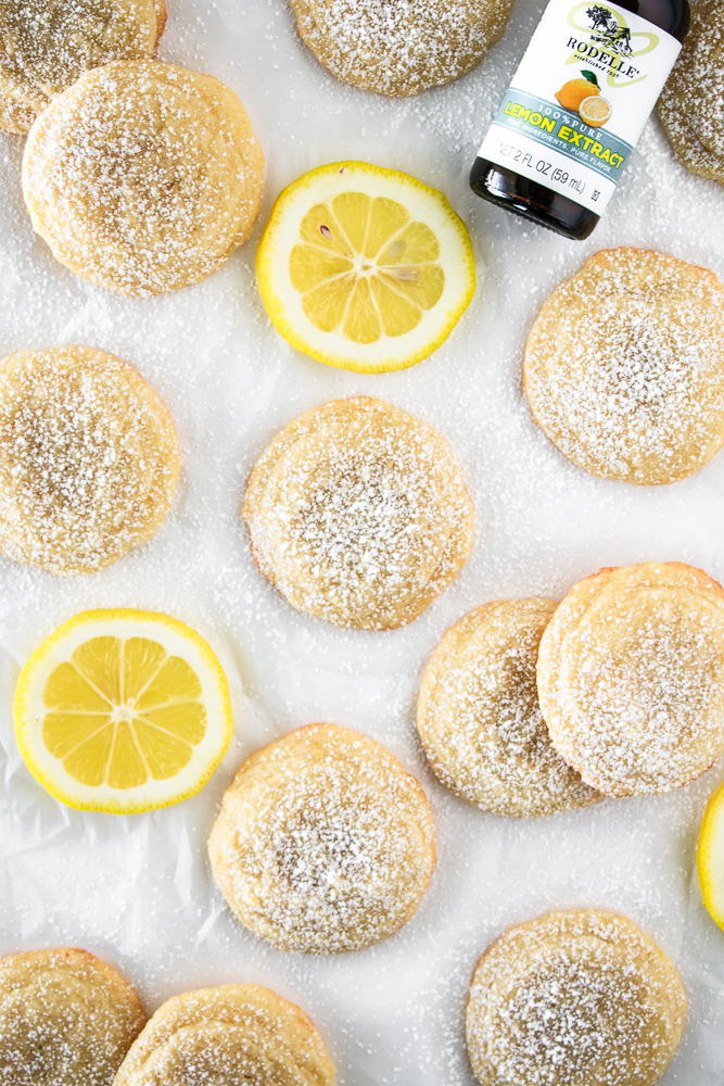 Lemon cookies with lemon slices on parchment paper