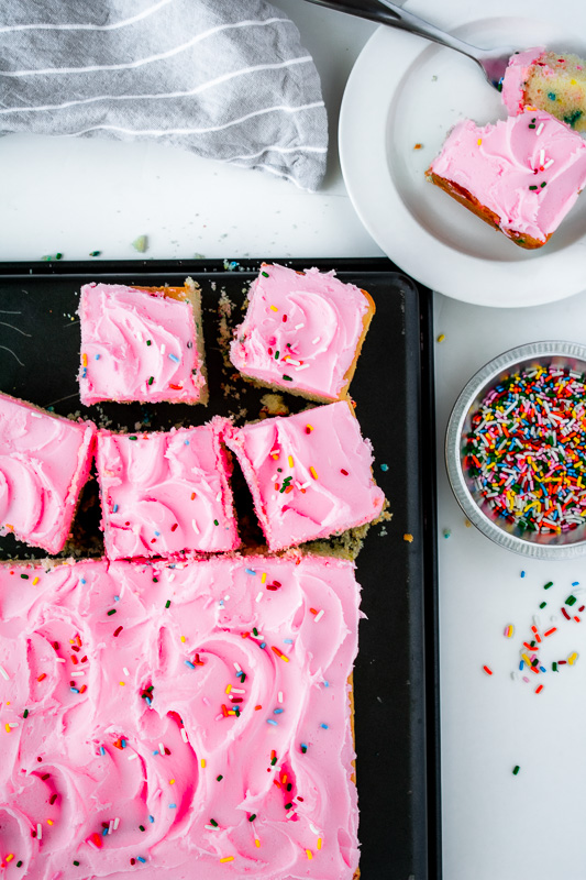 Slices of funfetti cake with sprinkles in a small dish. 
