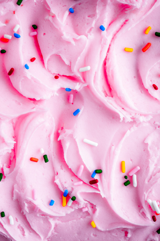 Pink buttercream frosting with sprinkles