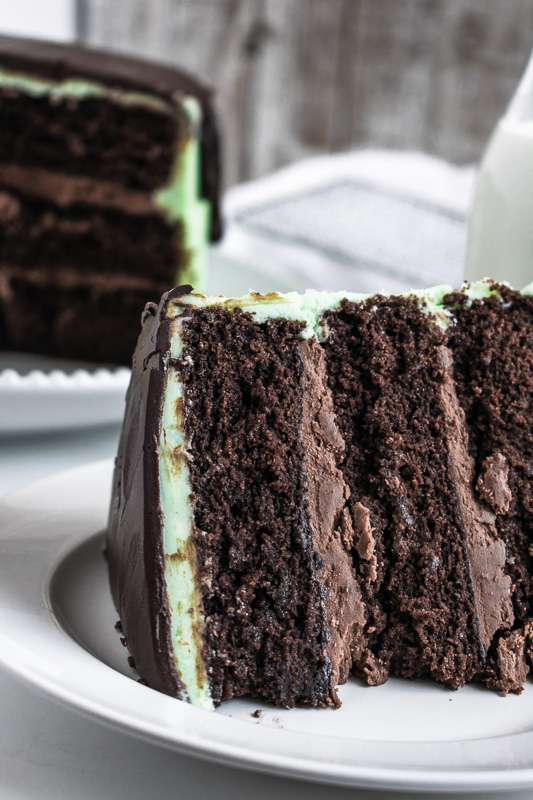 Slice of grasshopper cake on a white plate