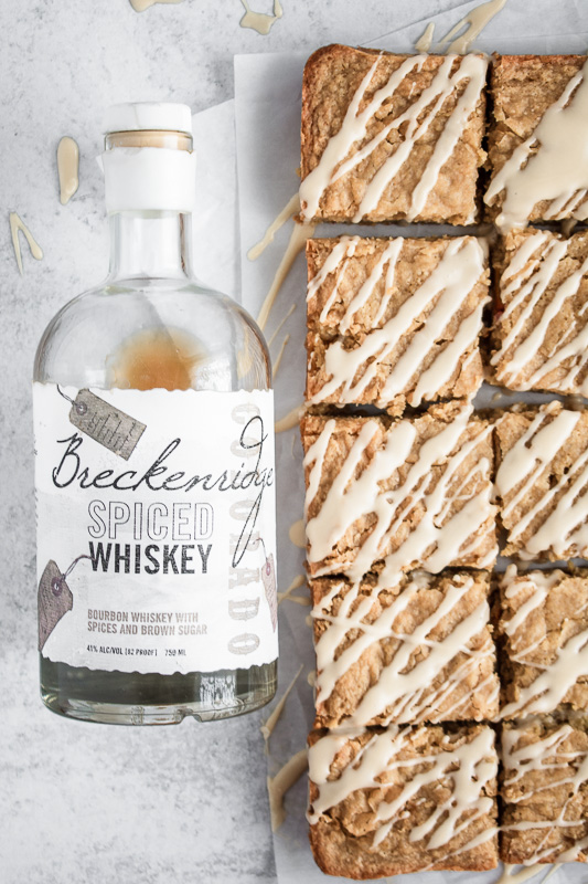 Breckenridge Distillery Spiced Whiskey next to maple peach blondies