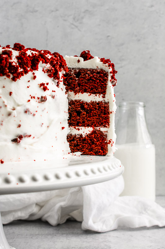 Red velvet cake on a white cake stand
