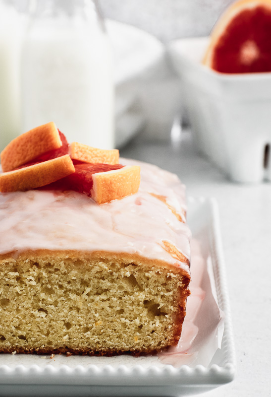 Close up of blood orange loaf cake with slice taken out