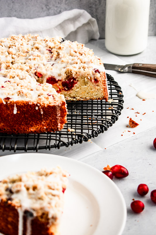 Side view of cranberry coffee cake with slice cut out