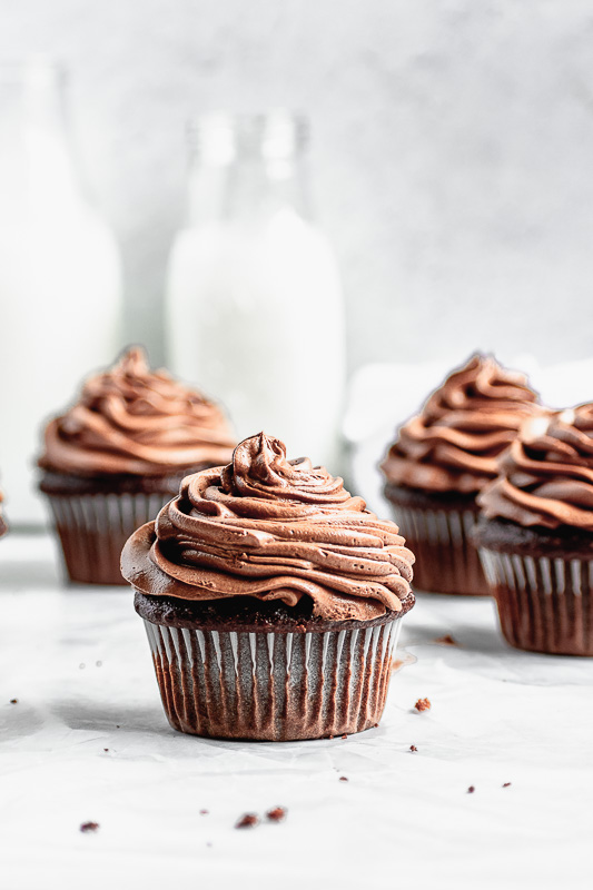 Dark chocolate buttercream on top of a double dark chocolate cupcake