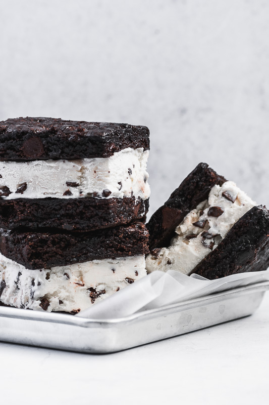Two mint brownie ice cream sandwiches stacked on top of each other