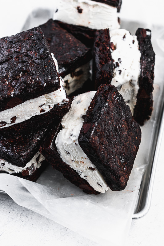 Mint brownie ice cream sandwiches in a pan