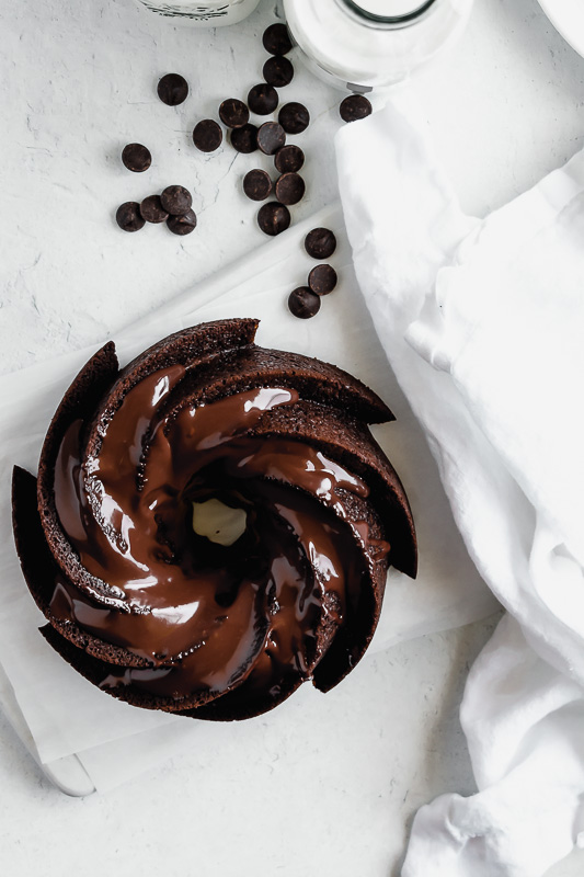 6 cup chocolate bundt cake surrounded by dark chocolate chips