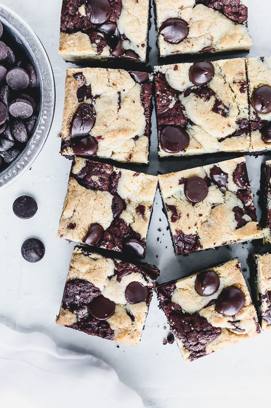 Chewy chocolate chip brookies with chocolate chips in a metal dish