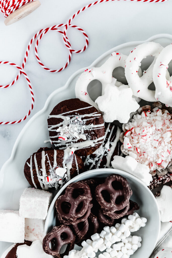 Peppermint and chocolate snacks on a white platter