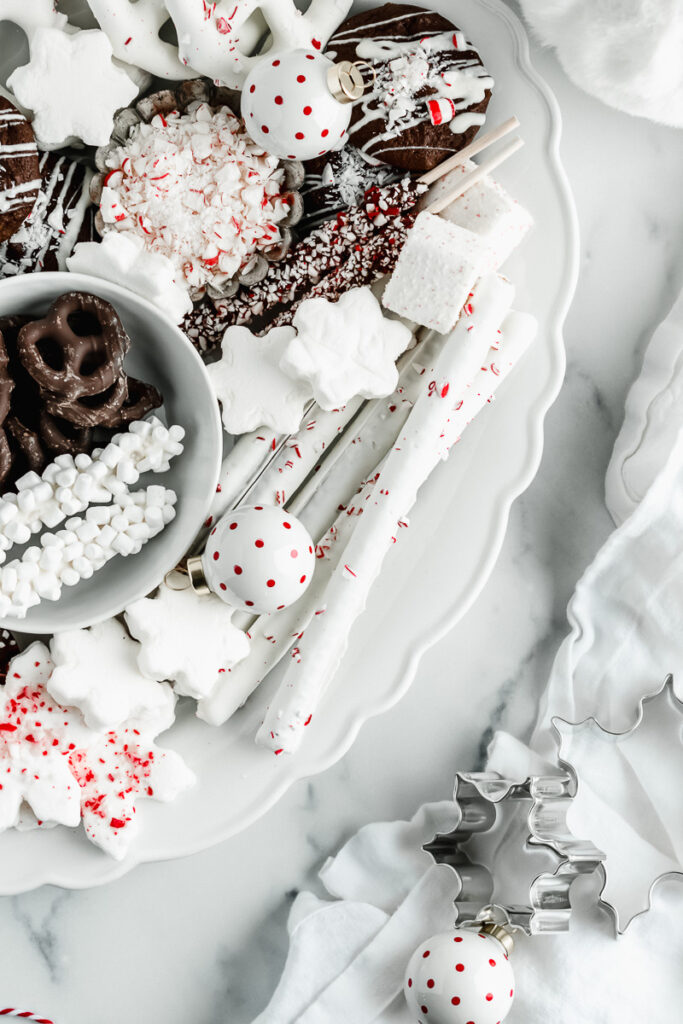 Peppermint and chocolate snacks on a white platter