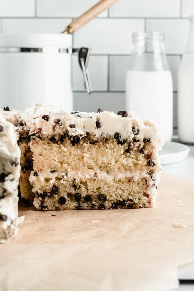 Slice of chocolate chip layer cake with brown sugar buttercream and mini chocolate chips