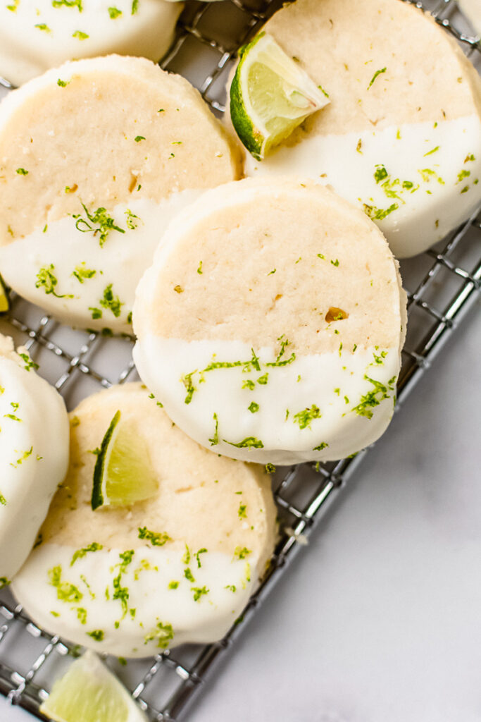 Key lime pie cookies on a metal cooling rack