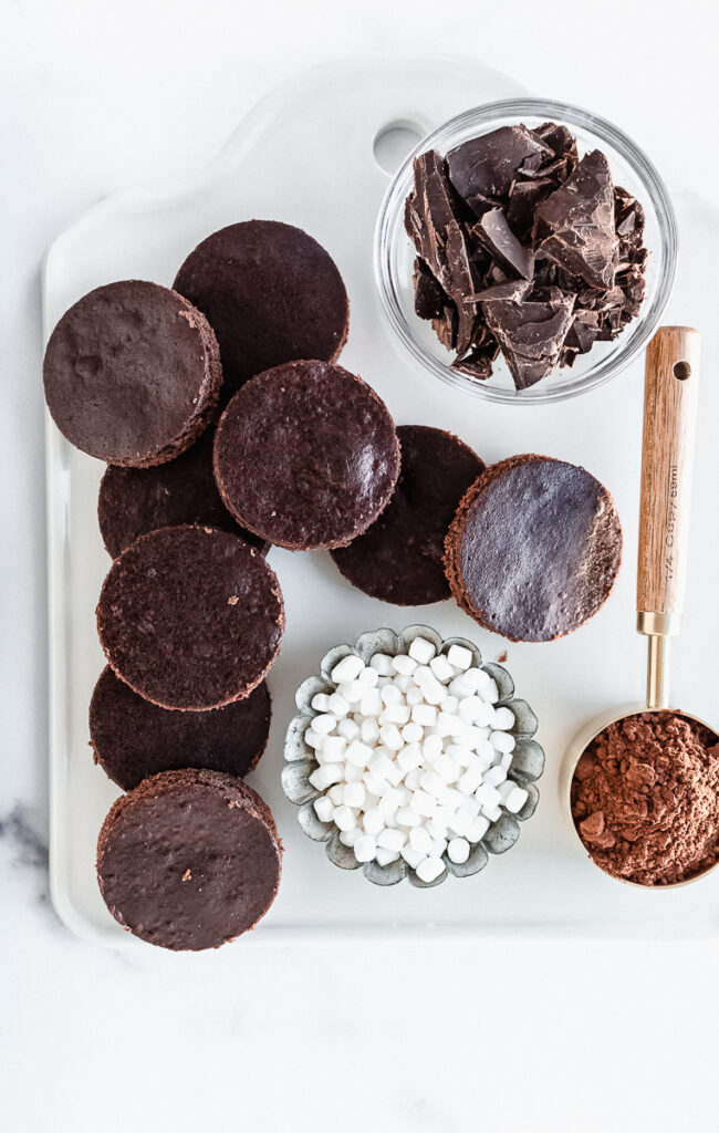 Ingredients for mini hot cocoa cakes on a white platter